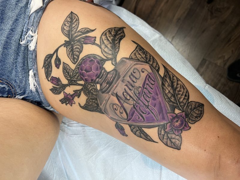 aqua-tofana-poison-bottle-thigh-tattoo-frank-luca-vatican-tattoo