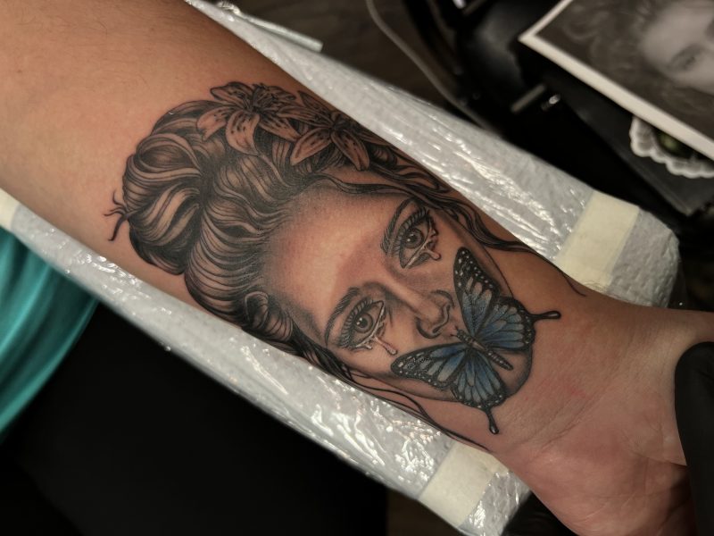 womens-portrait-butterfly-forearm-tattoo-frank-luca-vatican-tattoo