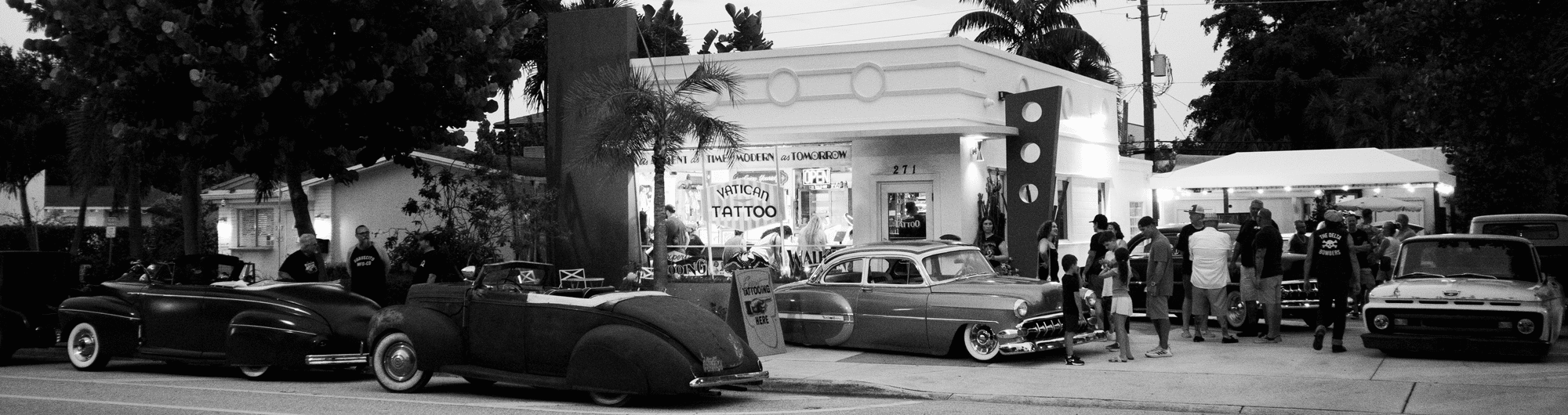 Vatican Tattoo Delray Beach grand re-opening with classic cars lined up outside the new shop at 271 NE 6th Ave